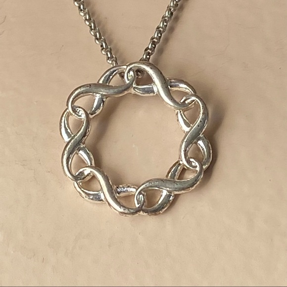 SAQ stamped women silver tone infinity twist circle pendant necklace. Used. - Picture 6 of 6